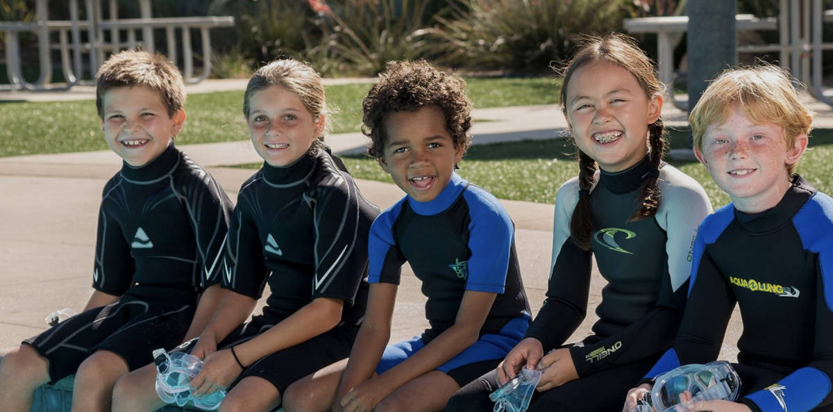5 Kids waiting for their scuba diving lesson
